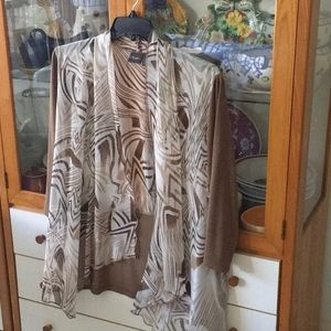 Chico’s Travelers jacket. Semi transparent. Easy fit. Worn fewer than five times